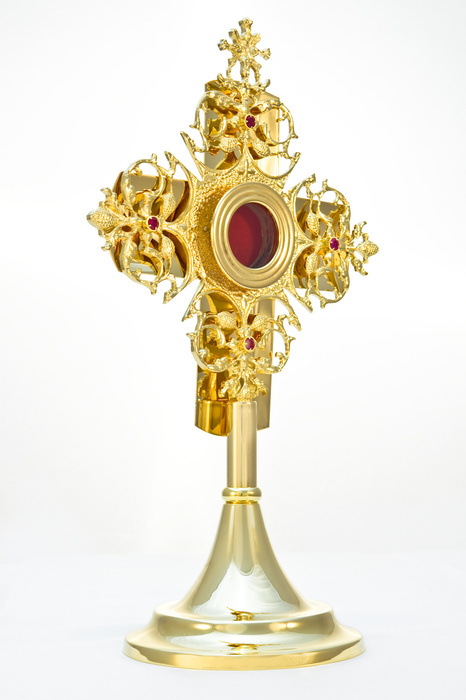 A magnificent brass reliquary in the form of a small monstrance decorated with rubies, 33 cm high