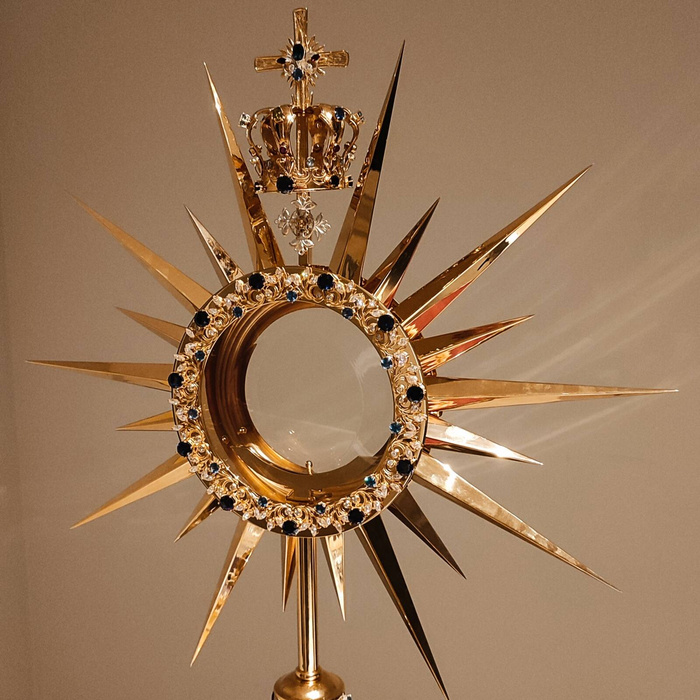 Large monstrance, gilded , decorated with stones with a height of 83 cm